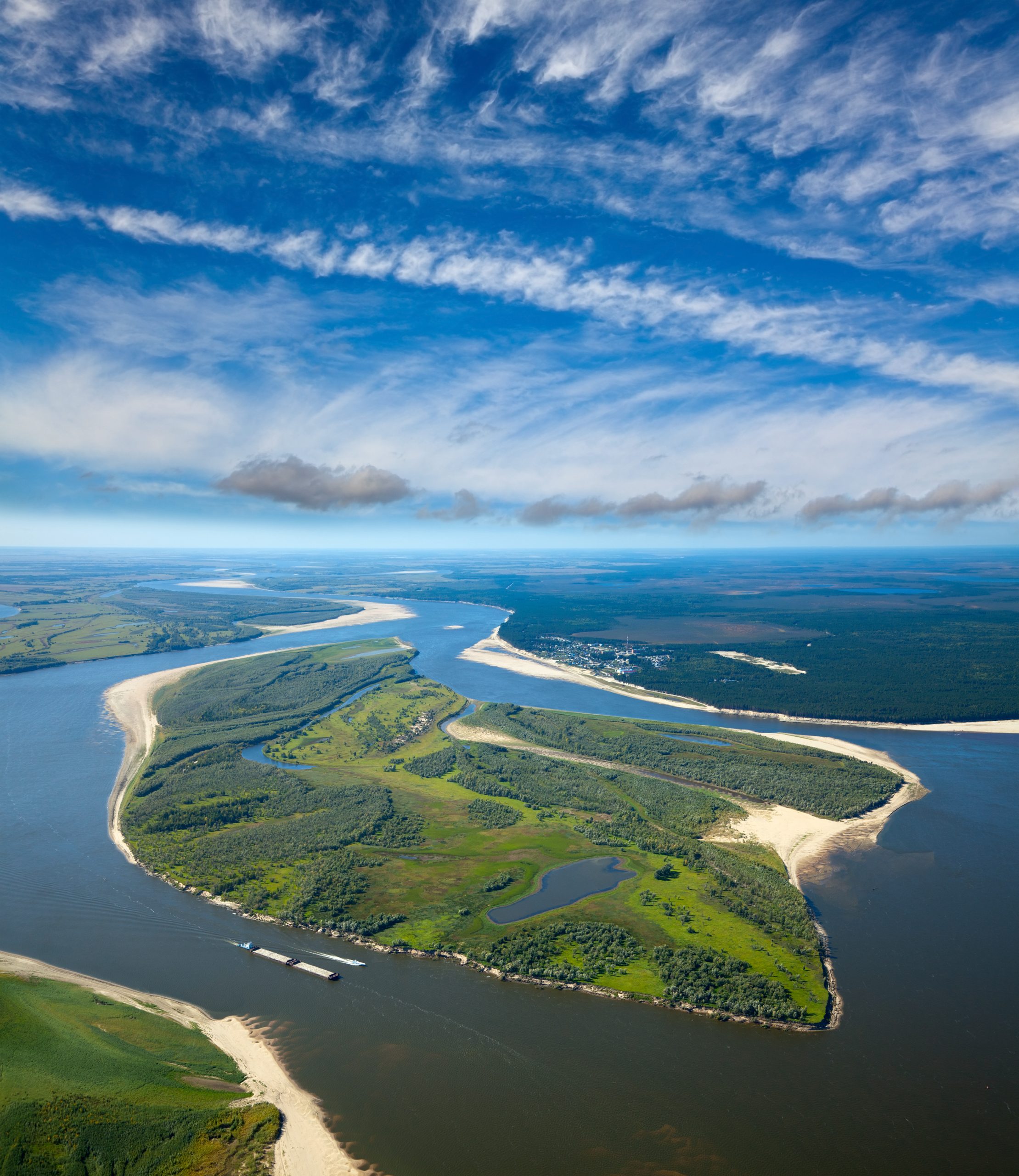 aerial view of a river with a barge using BargeOps inventory management