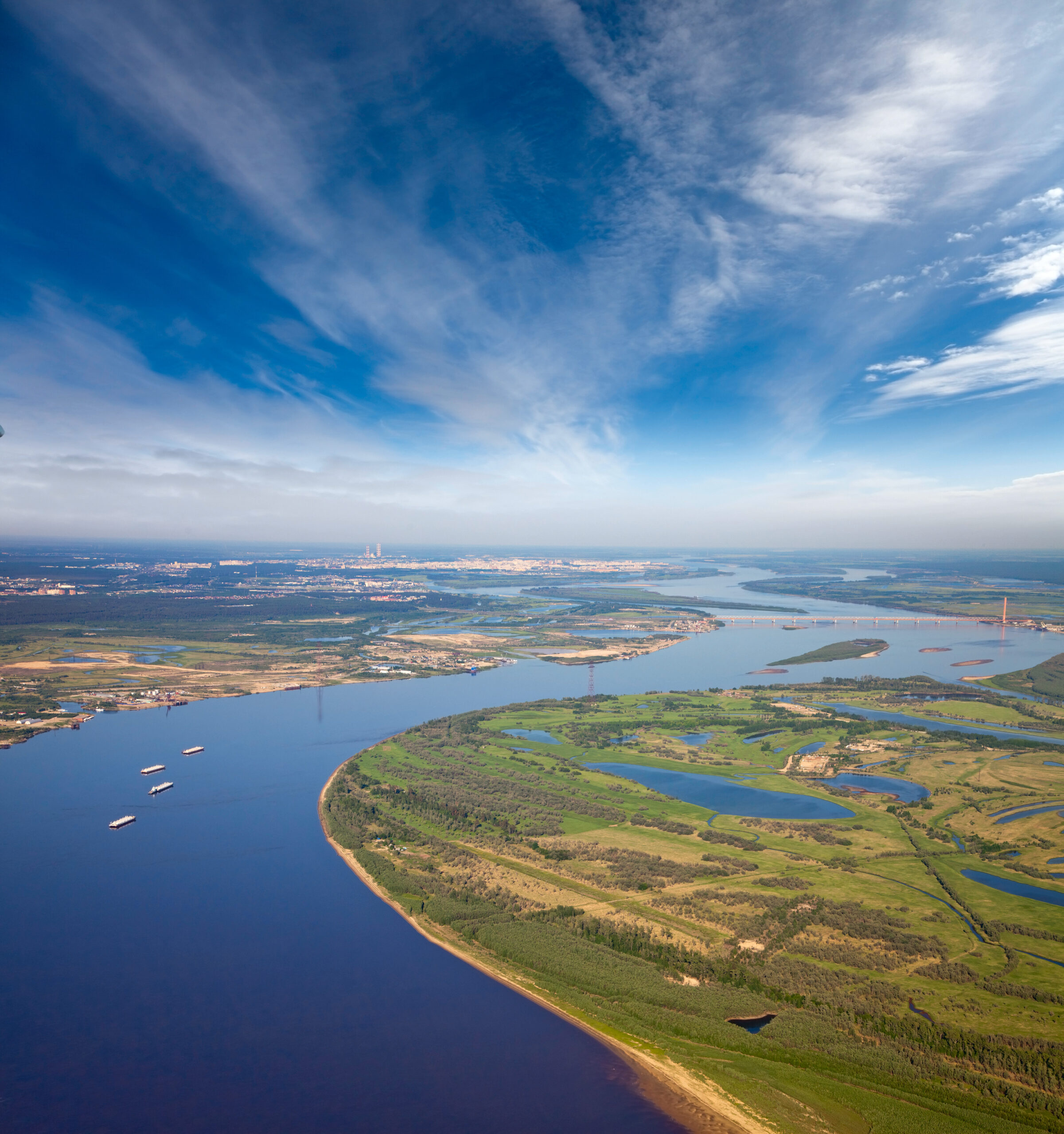 aerial view of a river with several barges